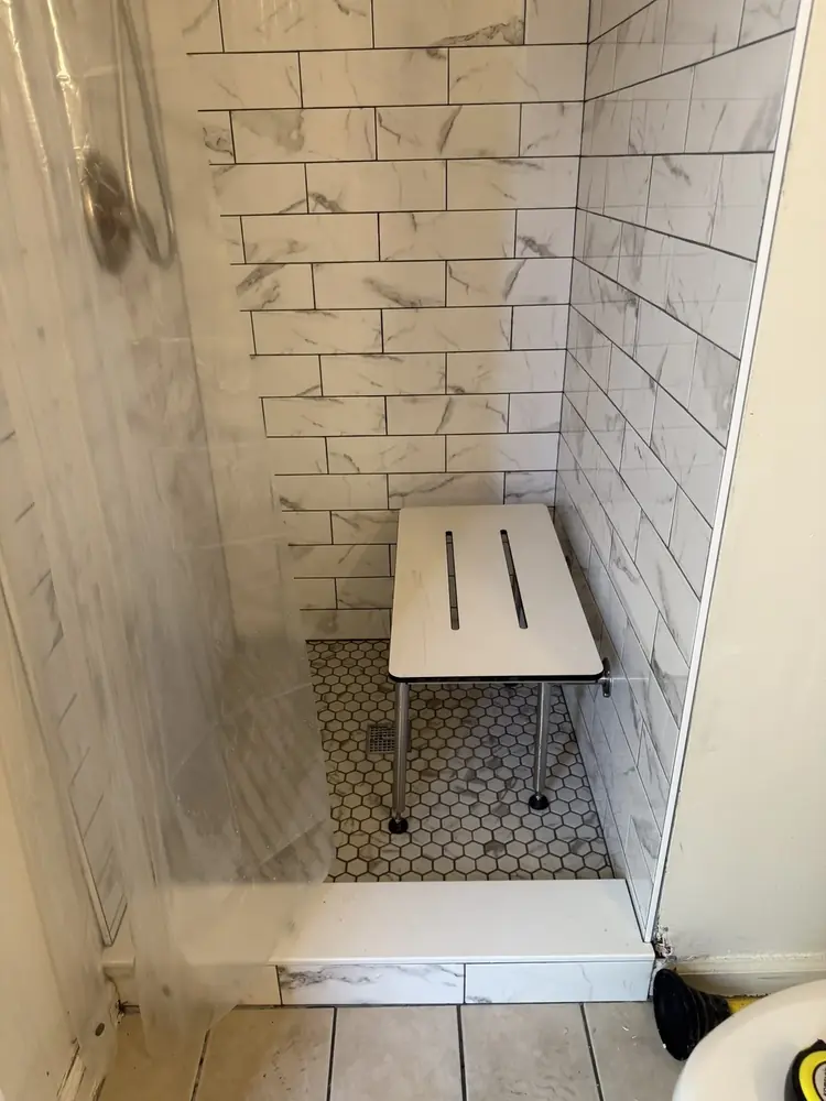 Tile walk-in shower with built-in bench