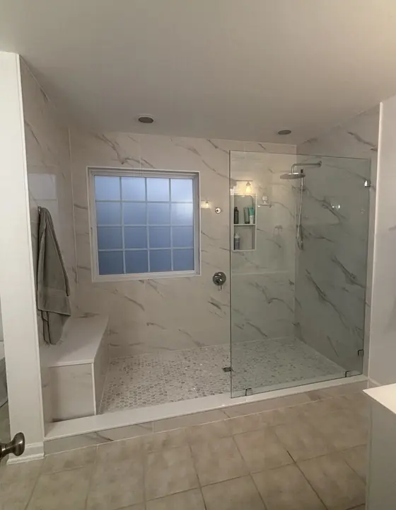 Bathroom remodel with glass shower and tub