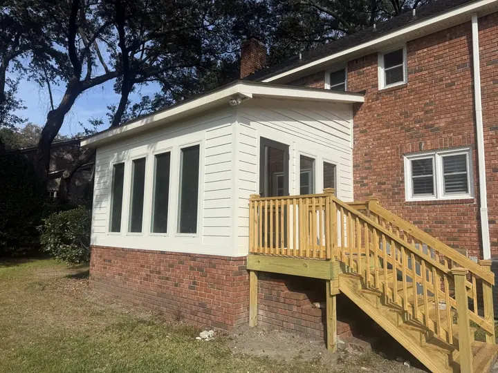 Sunroom addition on a brick home