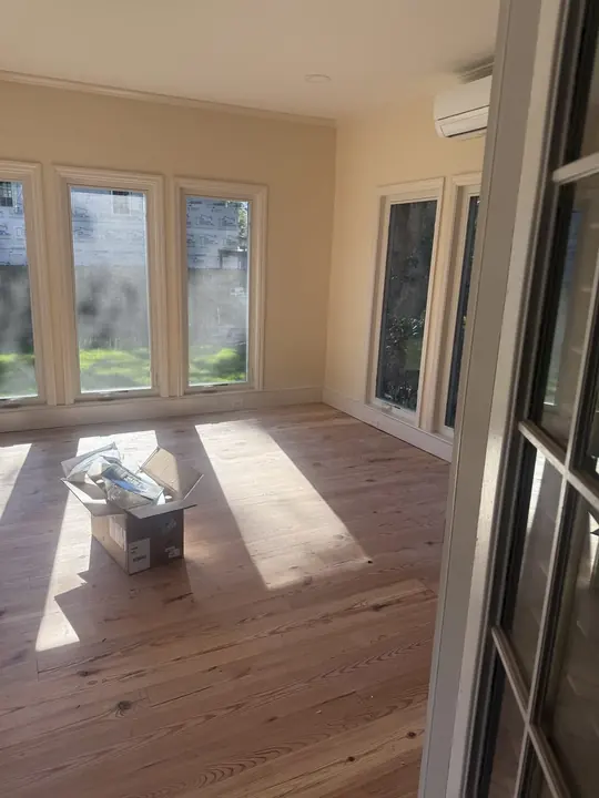 Finished sunroom interior, new wood flooring